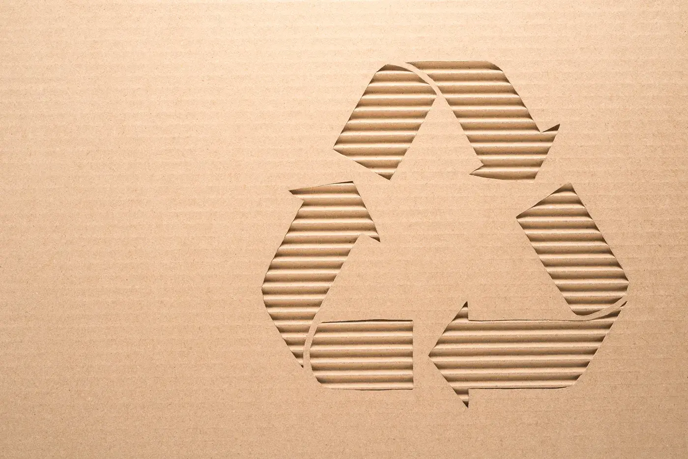 Recycle sign on corrugated cardboard