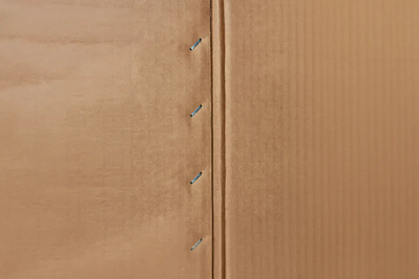 Stitched corrugated box seam